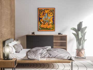 Hand-painted Acala thangka in a dark frame above a bedroom sideboard: the blue deity sits in flames holding a sword