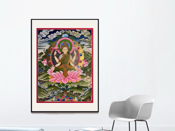 Hand-painted Laxmi thangka in a black frame with a white mat: the four-armed goddess sits on a pink lotus