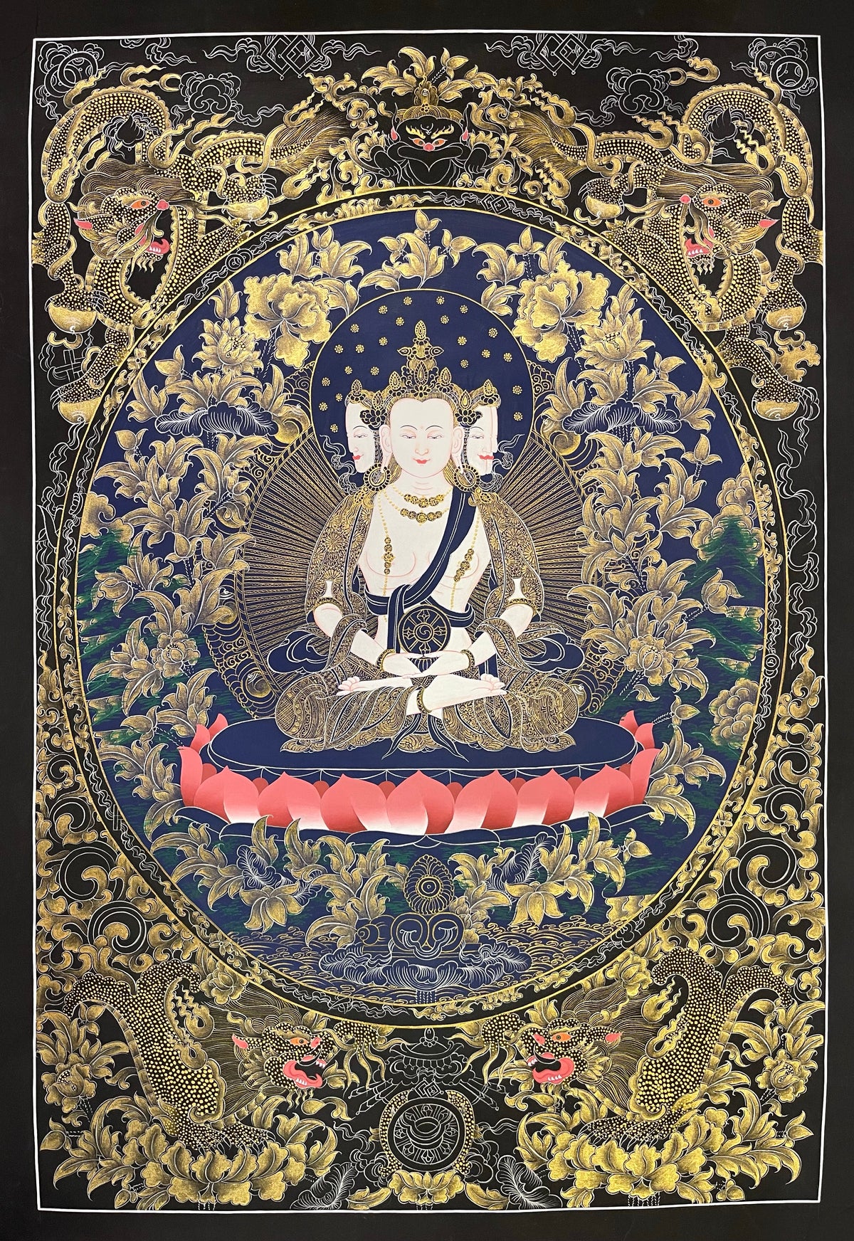 Vairocana thangka, 57×81 cm: four-faced white Vairocana with a dharma wheel in fine gold-coloured line work on navy, framed by four dragons