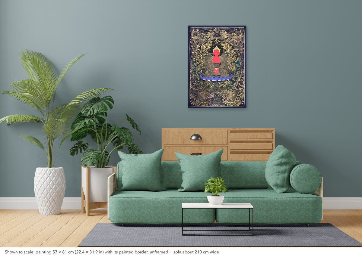 Amitabha Buddha thangka shown to scale in a living room, unframed, above a sofa about 210 cm wide (57×81 cm)