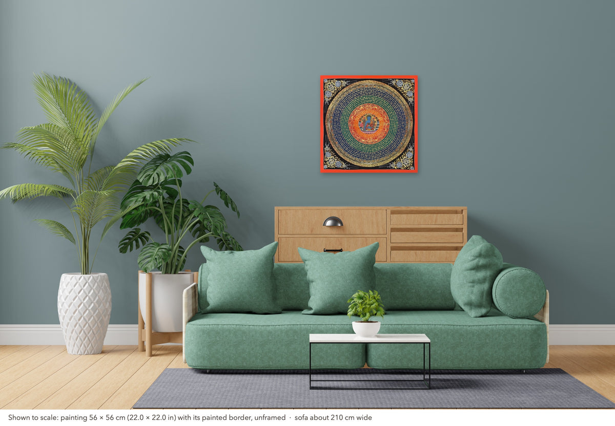 Medicine Buddha Mantra Mandala thangka shown to scale in a living room, unframed, above a sofa about 210 cm wide (56×56 cm)