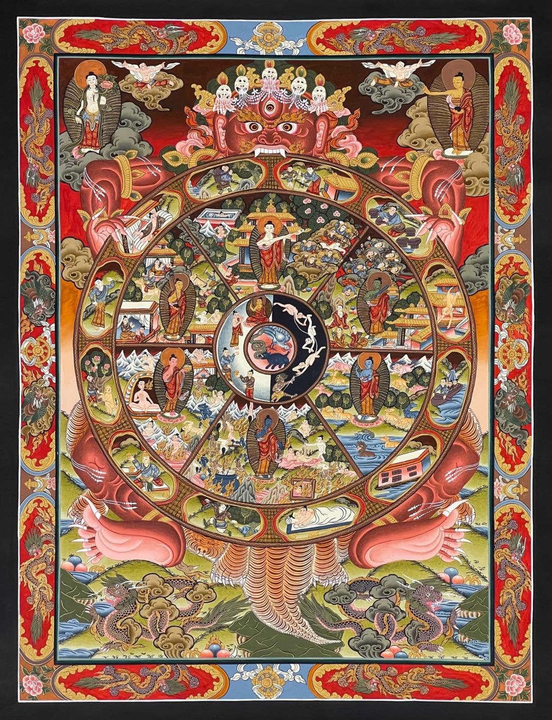 Wheel of Life thangka, 47×60 cm: red Yama holding the Wheel of Life with a Buddha in each realm, framed by a red and gold border of dragons