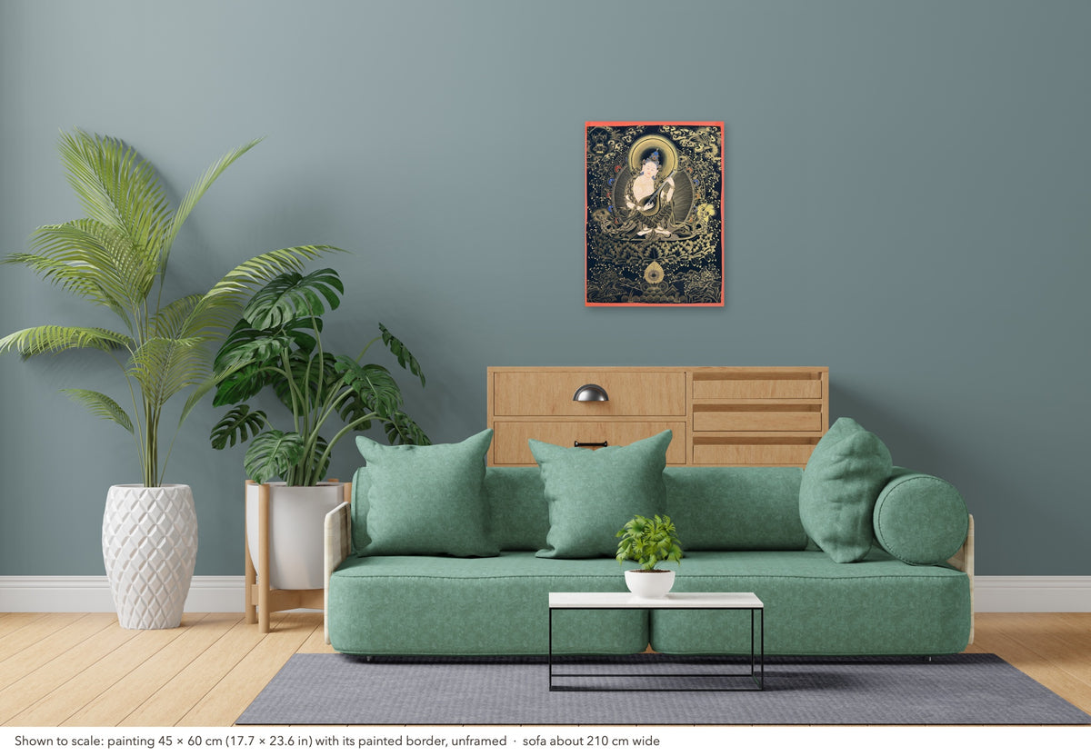 Saraswati thangka shown to scale in a living room, unframed, above a sofa about 210 cm wide (45×60 cm)