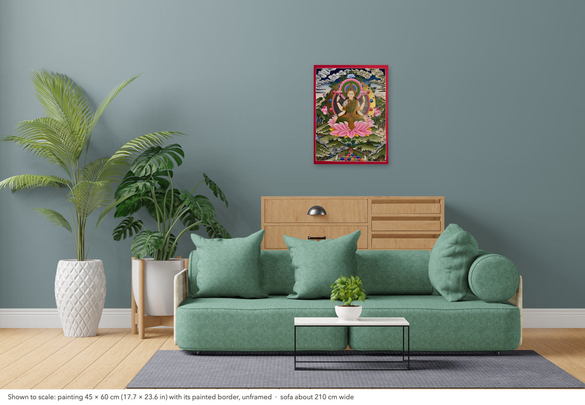 Laxmi thangka shown to scale in a living room, unframed, above a sofa about 210 cm wide (45×60 cm)