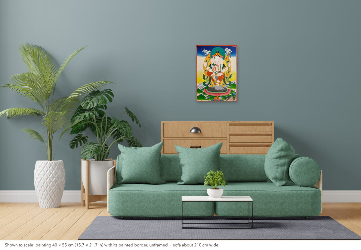 Ganesh thangka shown to scale in a living room, unframed, above a sofa about 210 cm wide (40×55 cm)