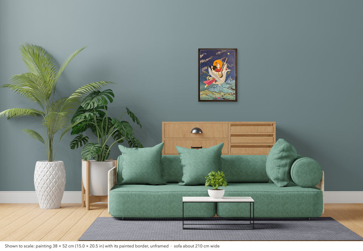 Saraswati thangka shown to scale in a living room, unframed, above a sofa about 210 cm wide (38×52 cm)