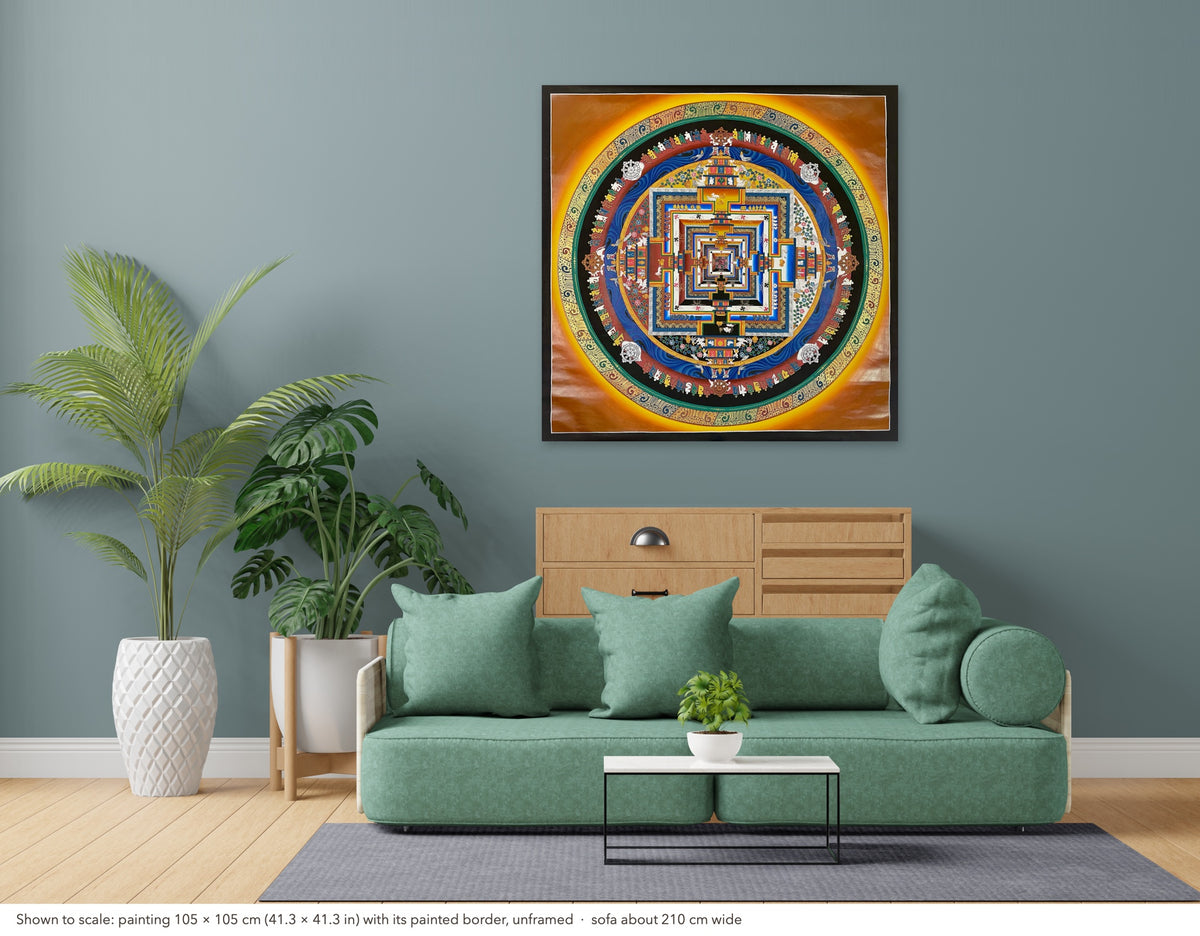 Kalachakra Mandala thangka shown to scale in a living room, unframed, above a sofa about 210 cm wide (105×105 cm)