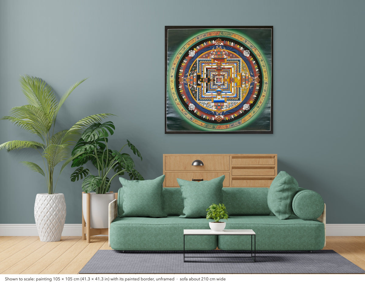 Kalachakra Mandala thangka shown to scale in a living room, unframed, above a sofa about 210 cm wide (105×105 cm)