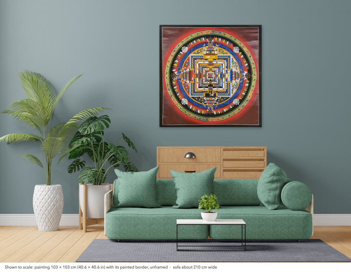 Kalachakra Mandala thangka shown to scale in a living room, unframed, above a sofa about 210 cm wide (103×103 cm)