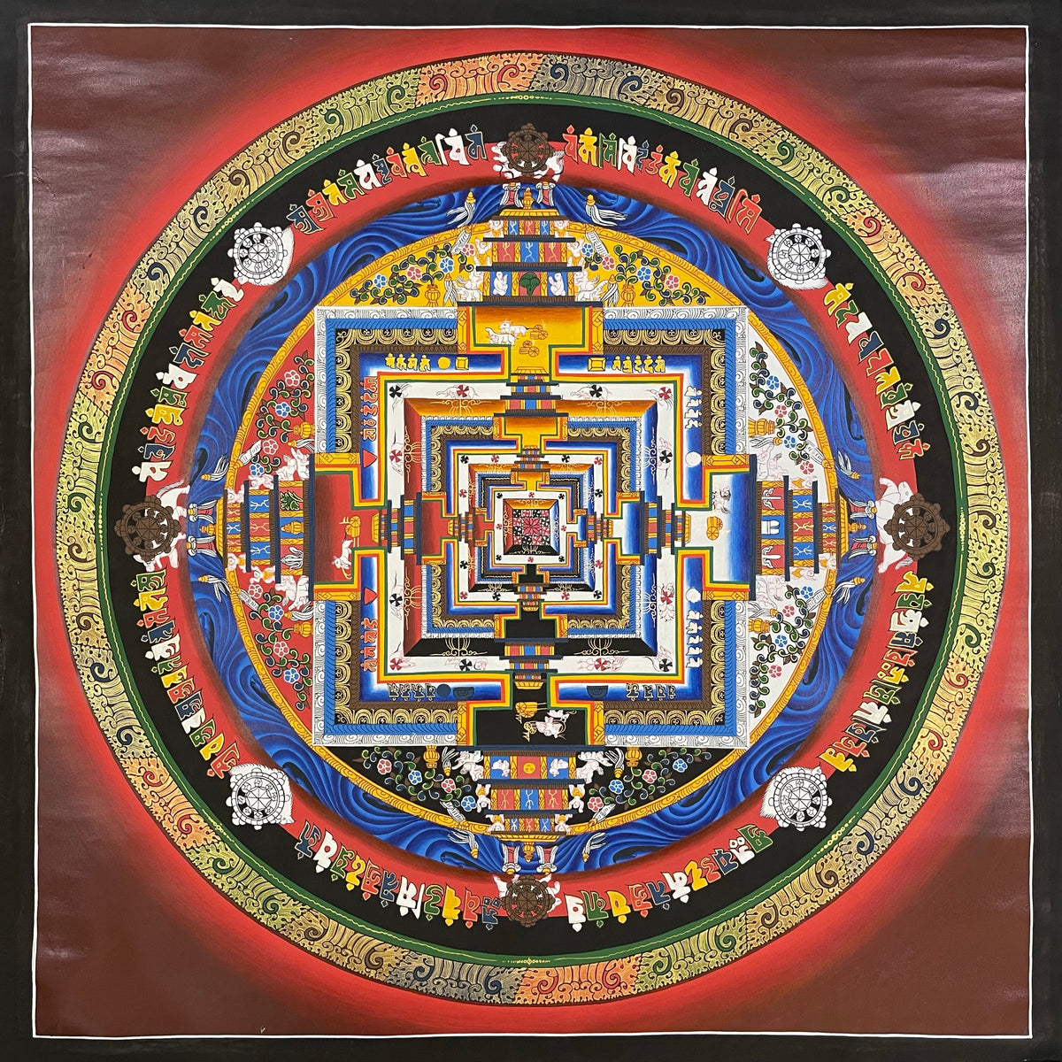 Kalachakra Mandala thangka, 103×103 cm: Kalachakra palace mandala with rings of mantra syllables and dharma wheels on a deep red ground