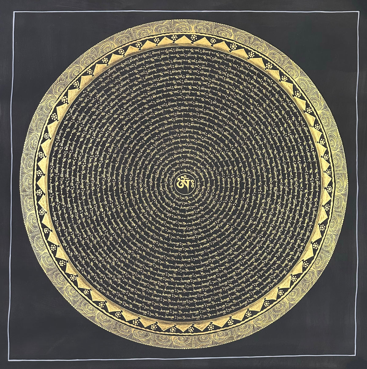 Mantra Mandala thangka, 108×108 cm: concentric rings of gold-coloured mantra script on black around a single Om, with a border of triangles