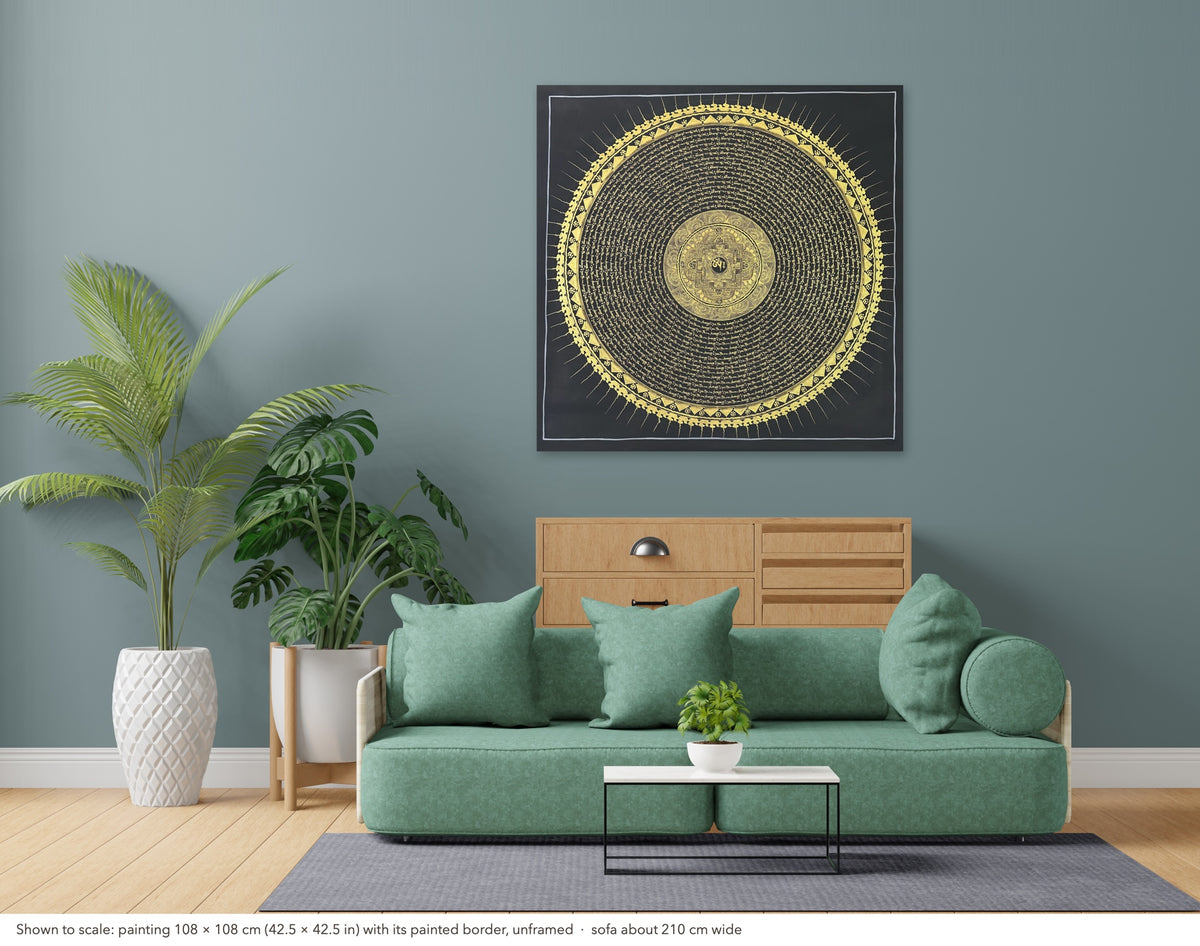 Mantra Mandala thangka shown to scale in a living room, unframed, above a sofa about 210 cm wide (108×108 cm)