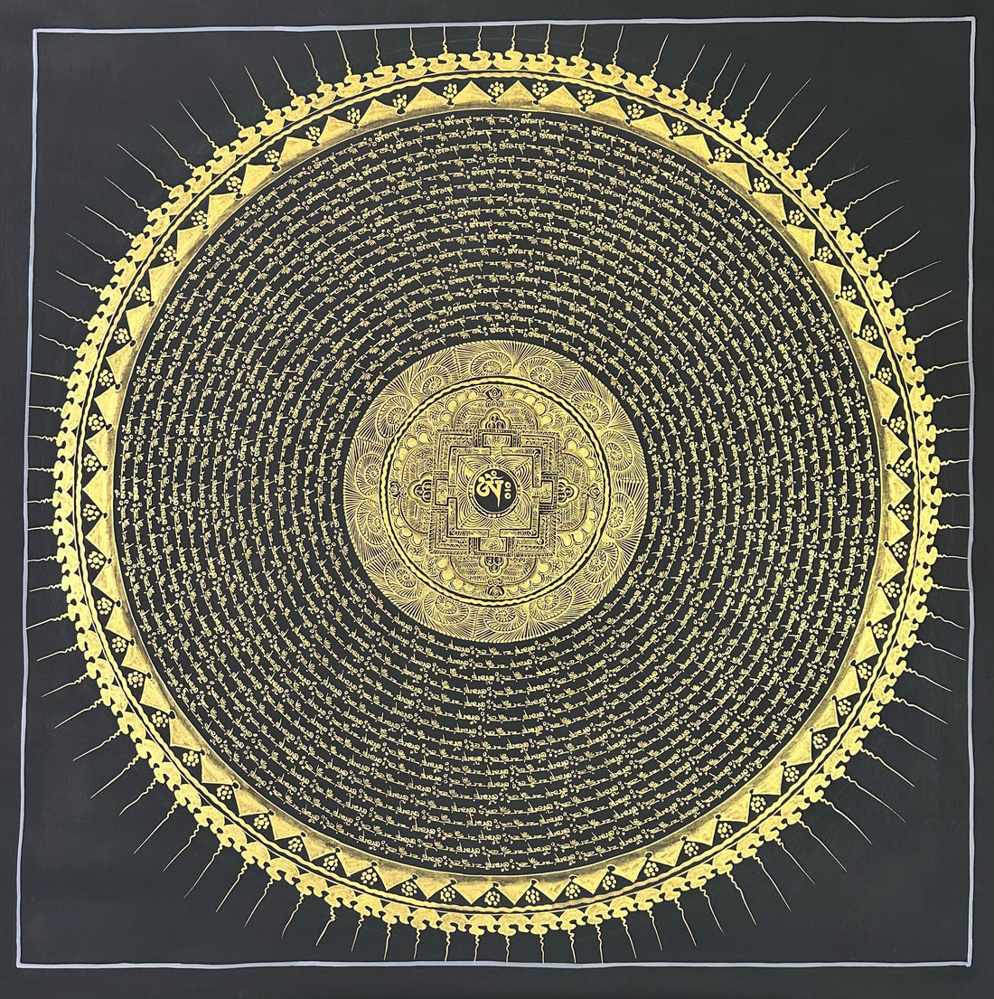 Mantra Mandala thangka, 108×108 cm: rings of gold-coloured mantra script on black around a small palace mandala, with a sun-ray border