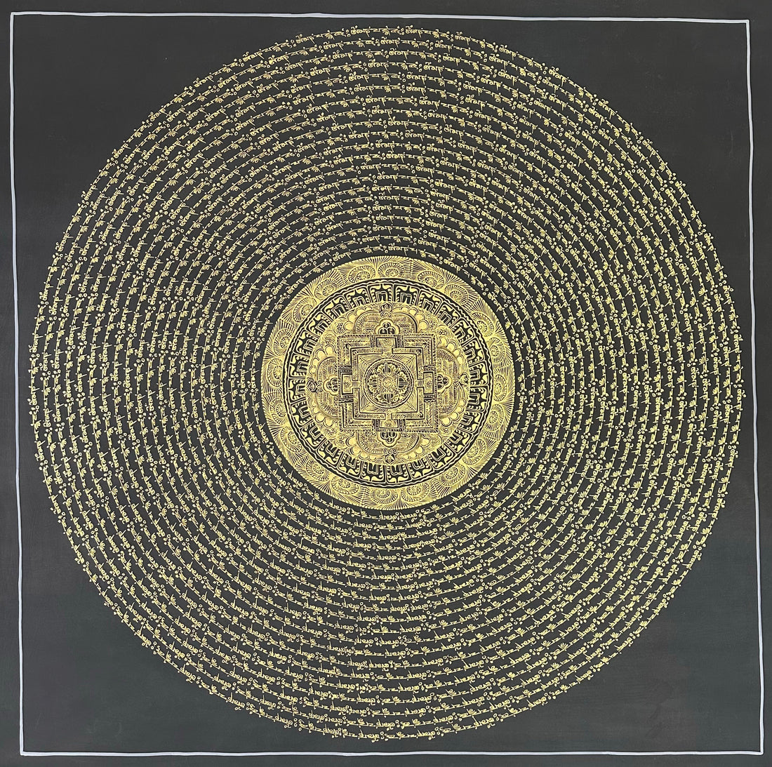 Mantra Mandala thangka, 108×108 cm: open rings of gold-coloured mantra script on black around a small palace mandala with a dharma wheel