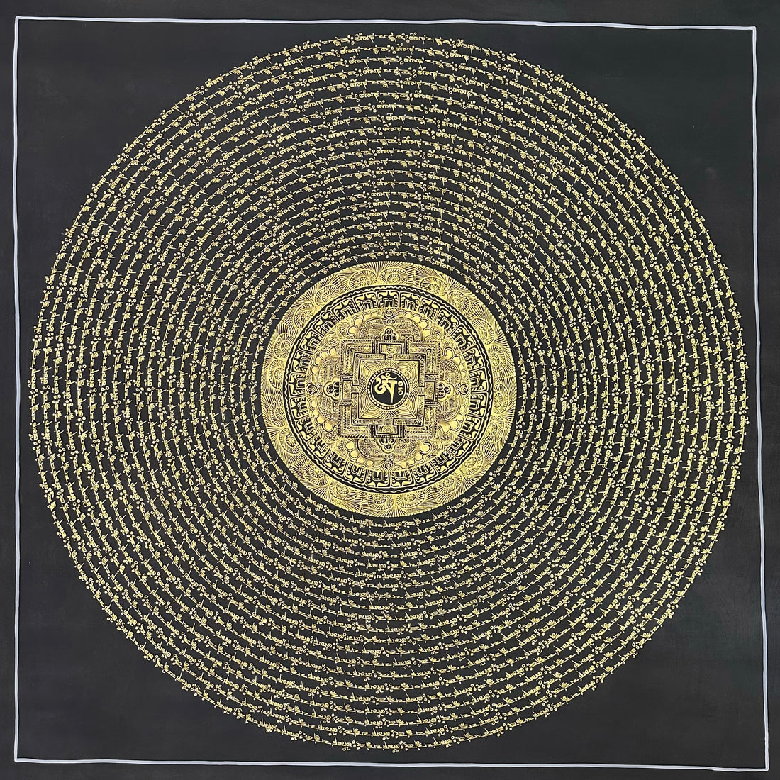 Mantra Mandala thangka, 108×108 cm: open rings of gold-coloured mantra script on black around a small palace mandala with Om