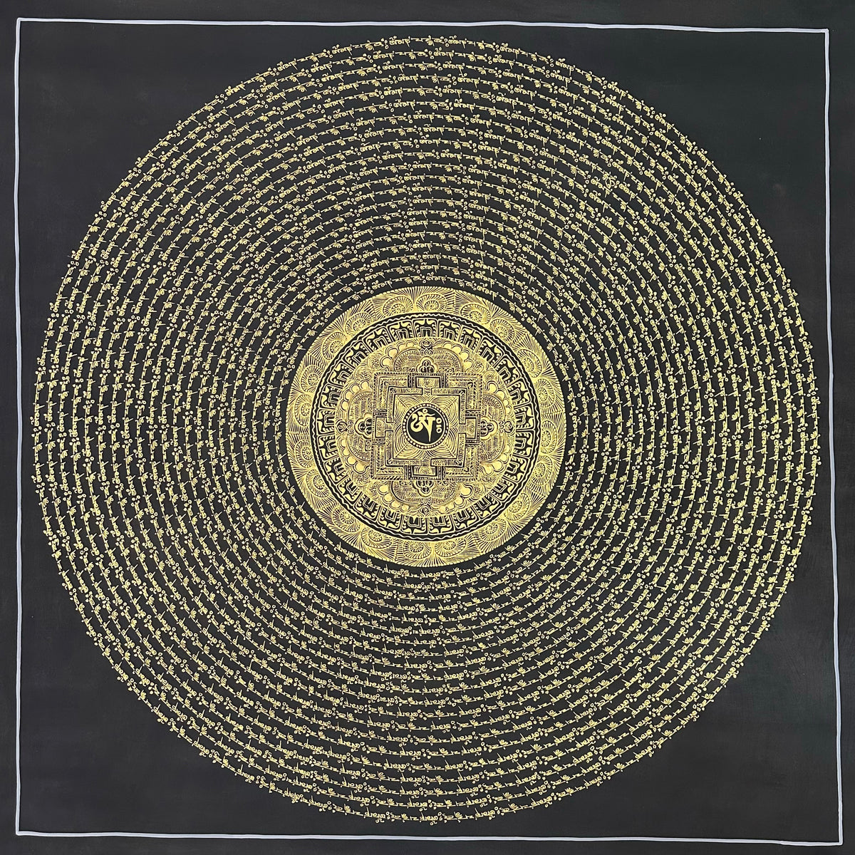 Mantra Mandala thangka, 108×108 cm: open rings of gold-coloured mantra script on black around a small palace mandala with Om