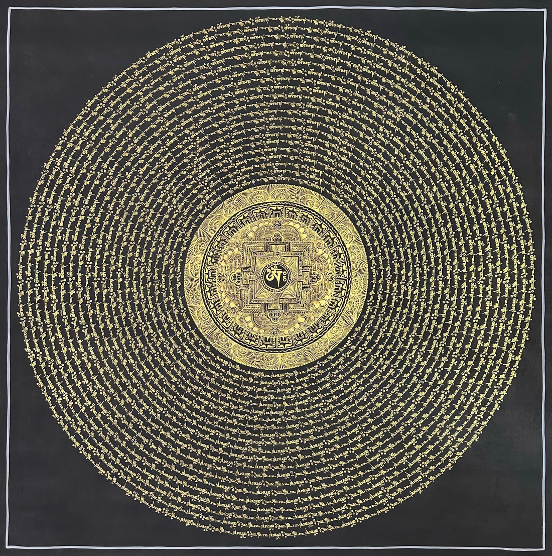 Mantra Mandala thangka, 108×108 cm: open rings of gold-coloured mantra script on black around a small palace mandala with Om