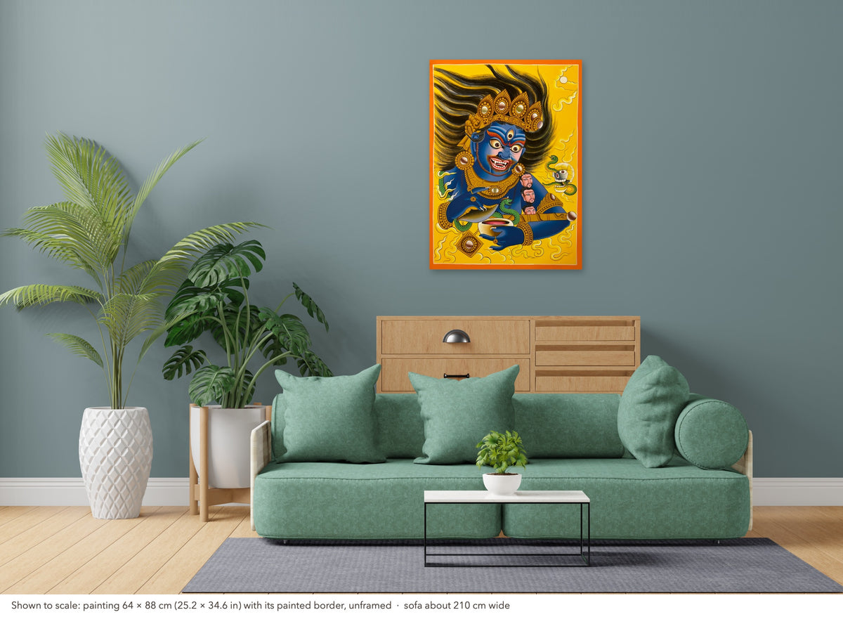Mahakala thangka shown to scale in a living room, unframed, above a sofa about 210 cm wide (64×88 cm)
