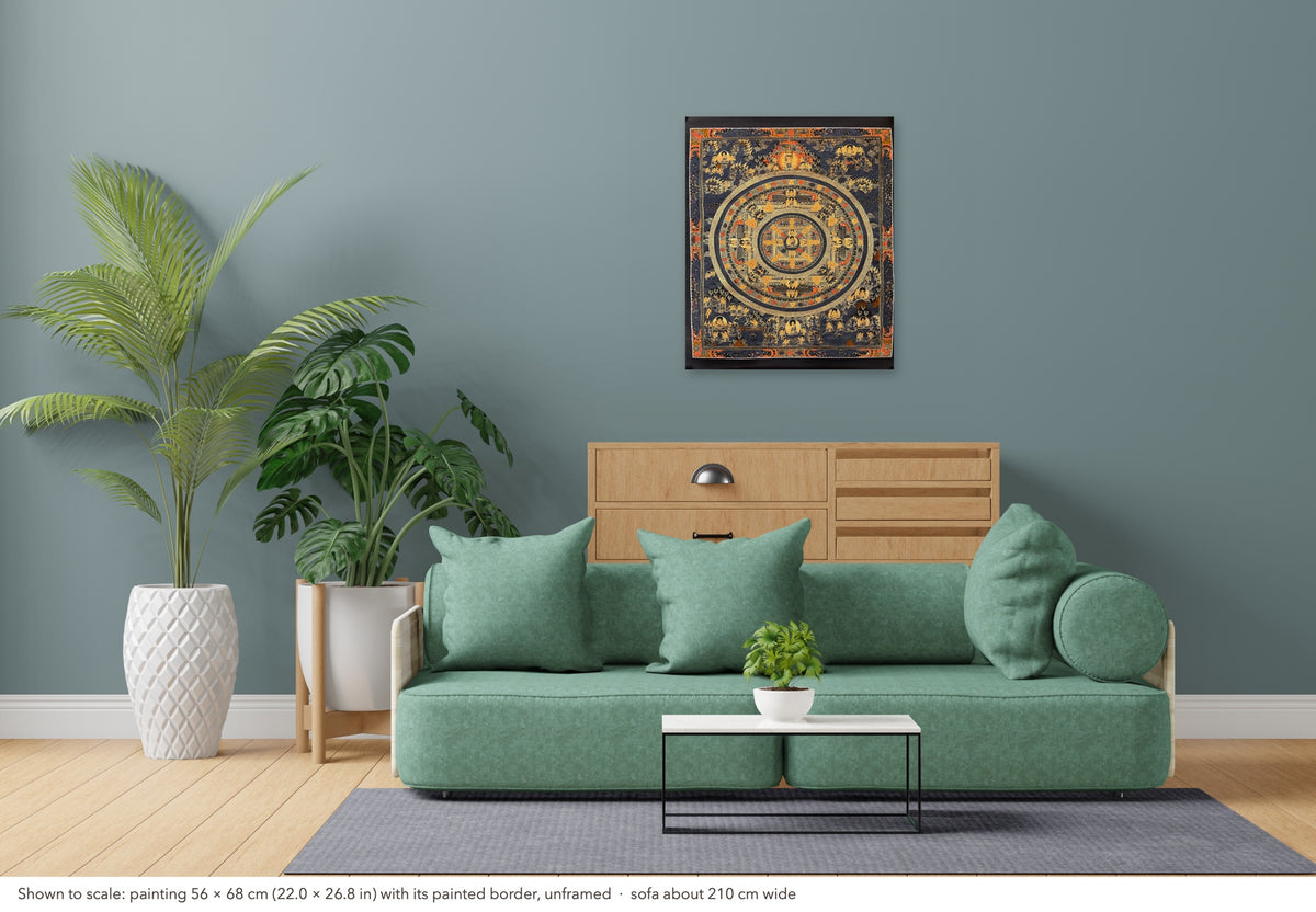 Buddha Mandala thangka shown to scale in a living room, unframed, above a sofa about 210 cm wide (56×68 cm)