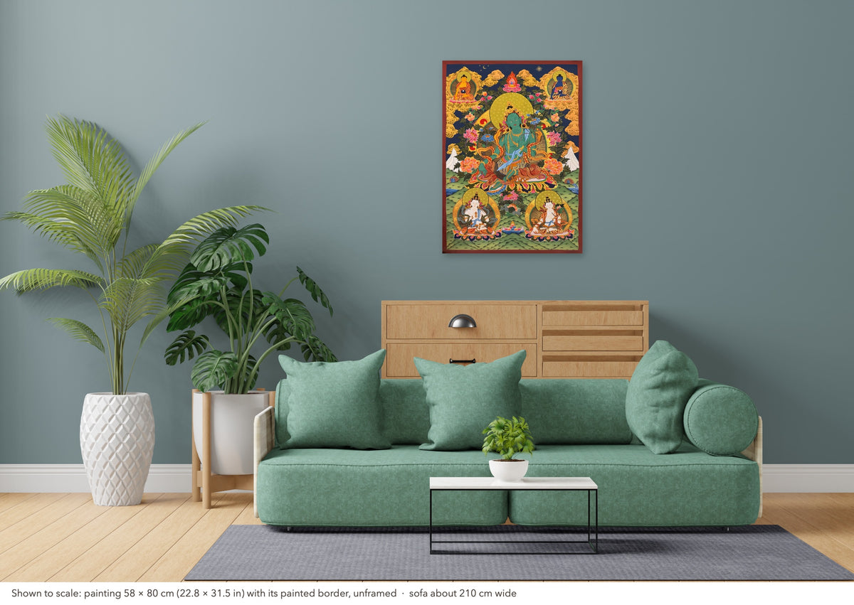 Green Tara thangka shown to scale in a living room, unframed, above a sofa about 210 cm wide (58×80 cm)