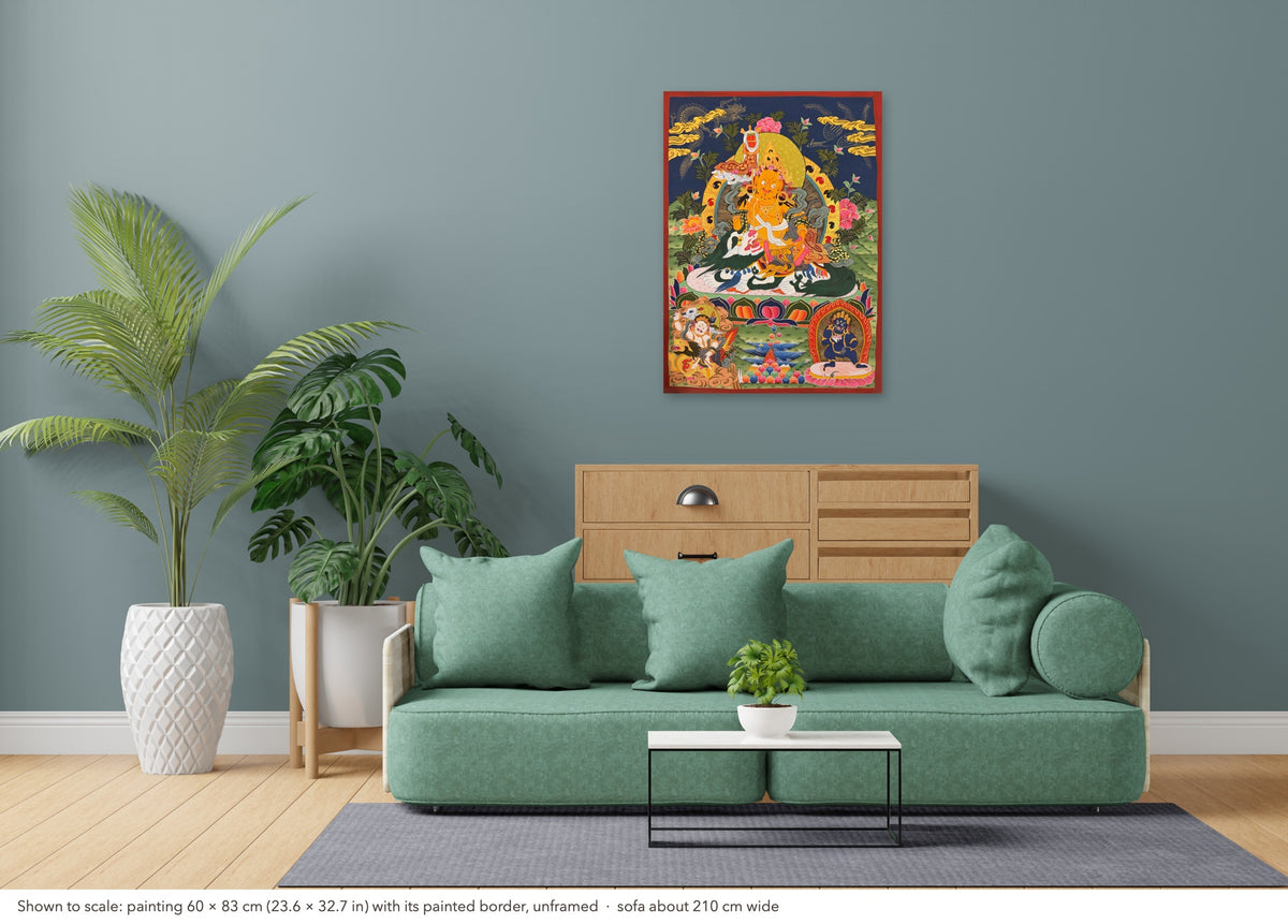 Vaishravana thangka shown to scale in a living room, unframed, above a sofa about 210 cm wide (60×83 cm)