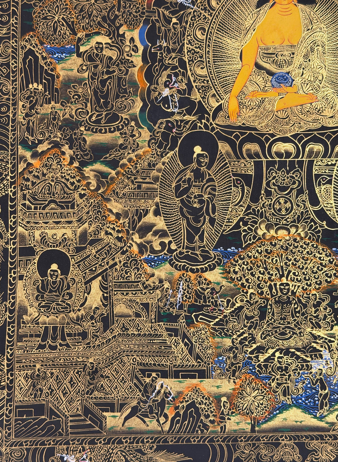 Buddha Life Story thangka, 53×68 cm: Shakyamuni surrounded by scenes of his life, in gold-coloured line work on black