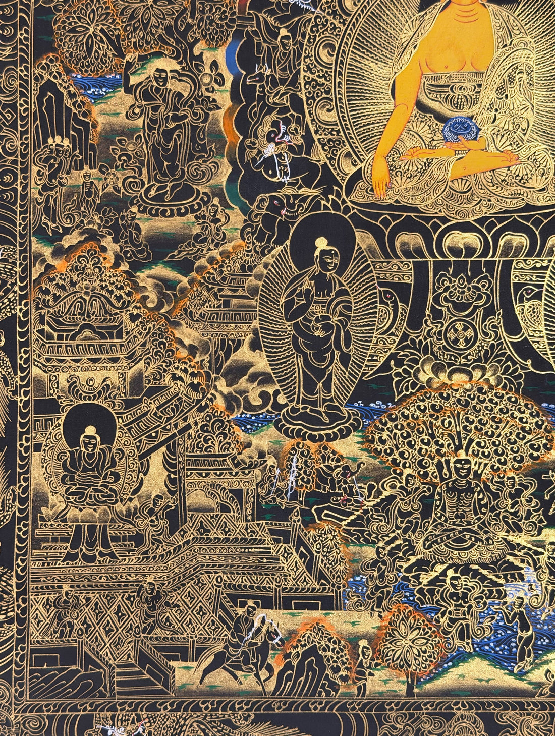 Buddha Life Story thangka, 53×68 cm: Shakyamuni surrounded by scenes of his life, in gold-coloured line work on black