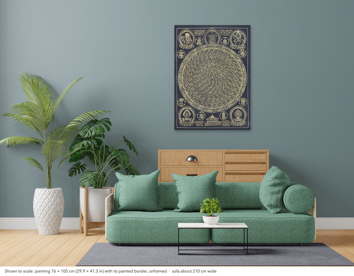 Mantra Mandala thangka shown to scale in a living room, unframed, above a sofa about 210 cm wide (76×105 cm)