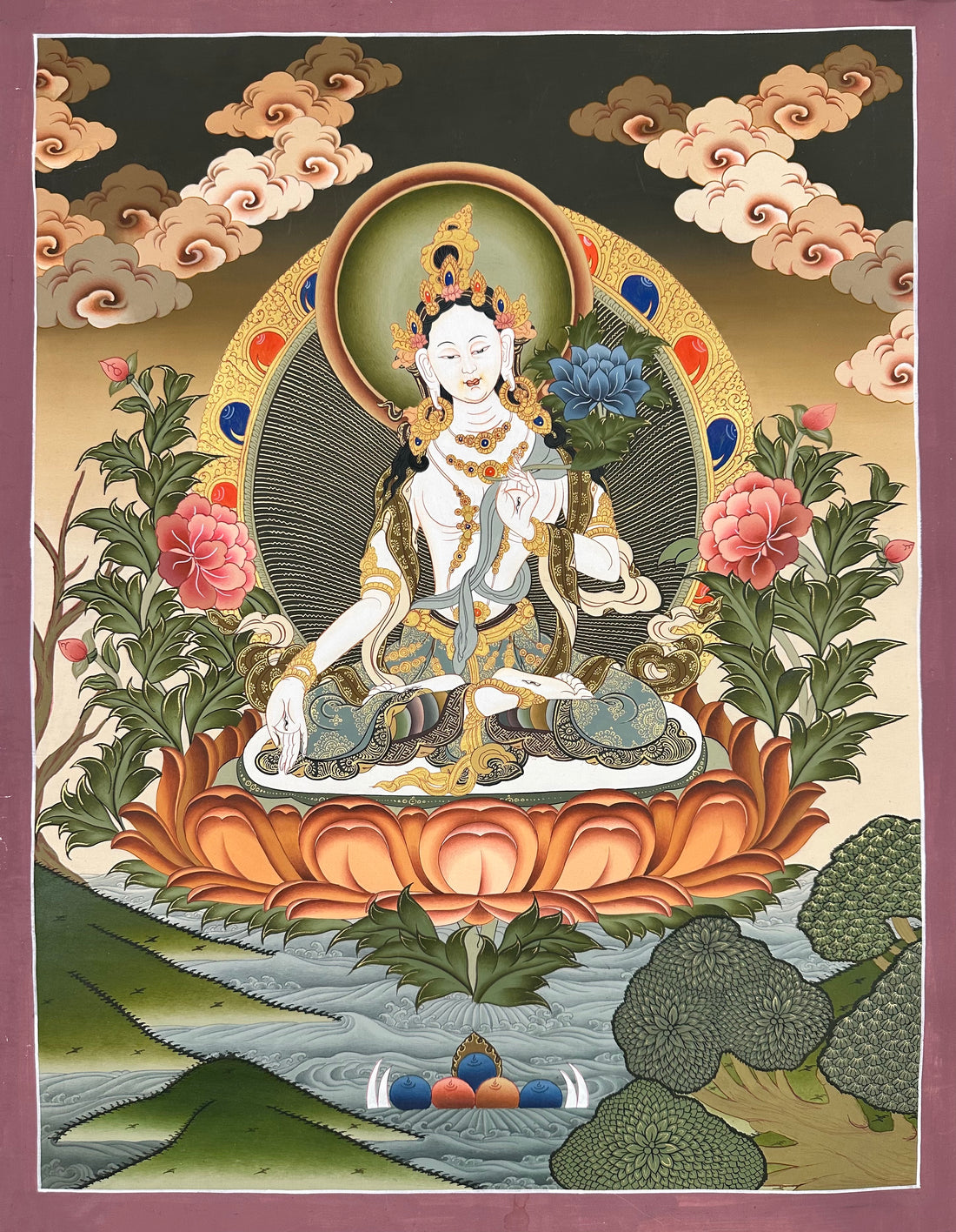 White Tara thangka, 36×49 cm: White Tara seated on a peach lotus holding a blue lotus, with peonies, clouds and a river