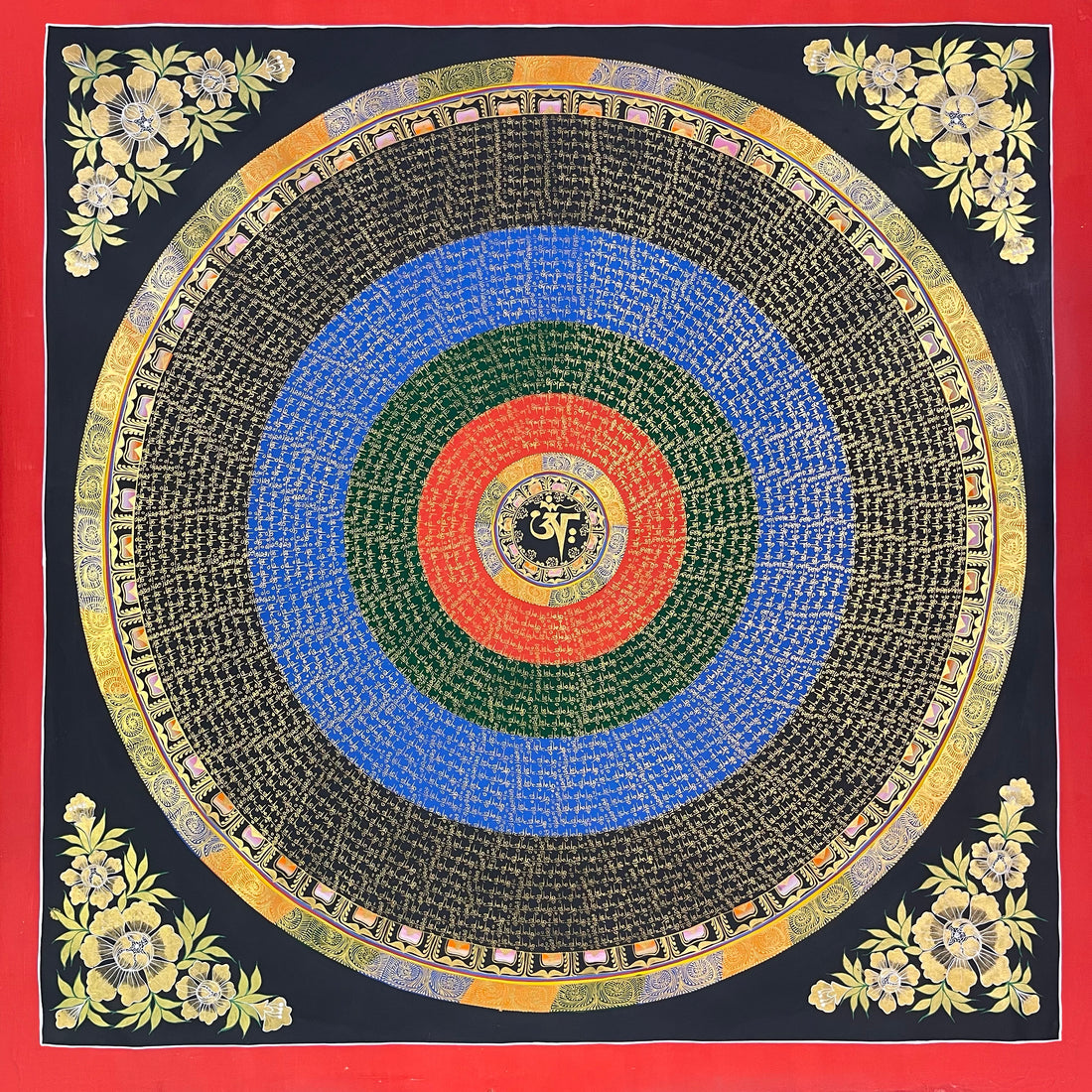 Mantra Mandala thangka, 110×110 cm: bands of gold-coloured mantra script on red, green, blue and black rings around a central Om