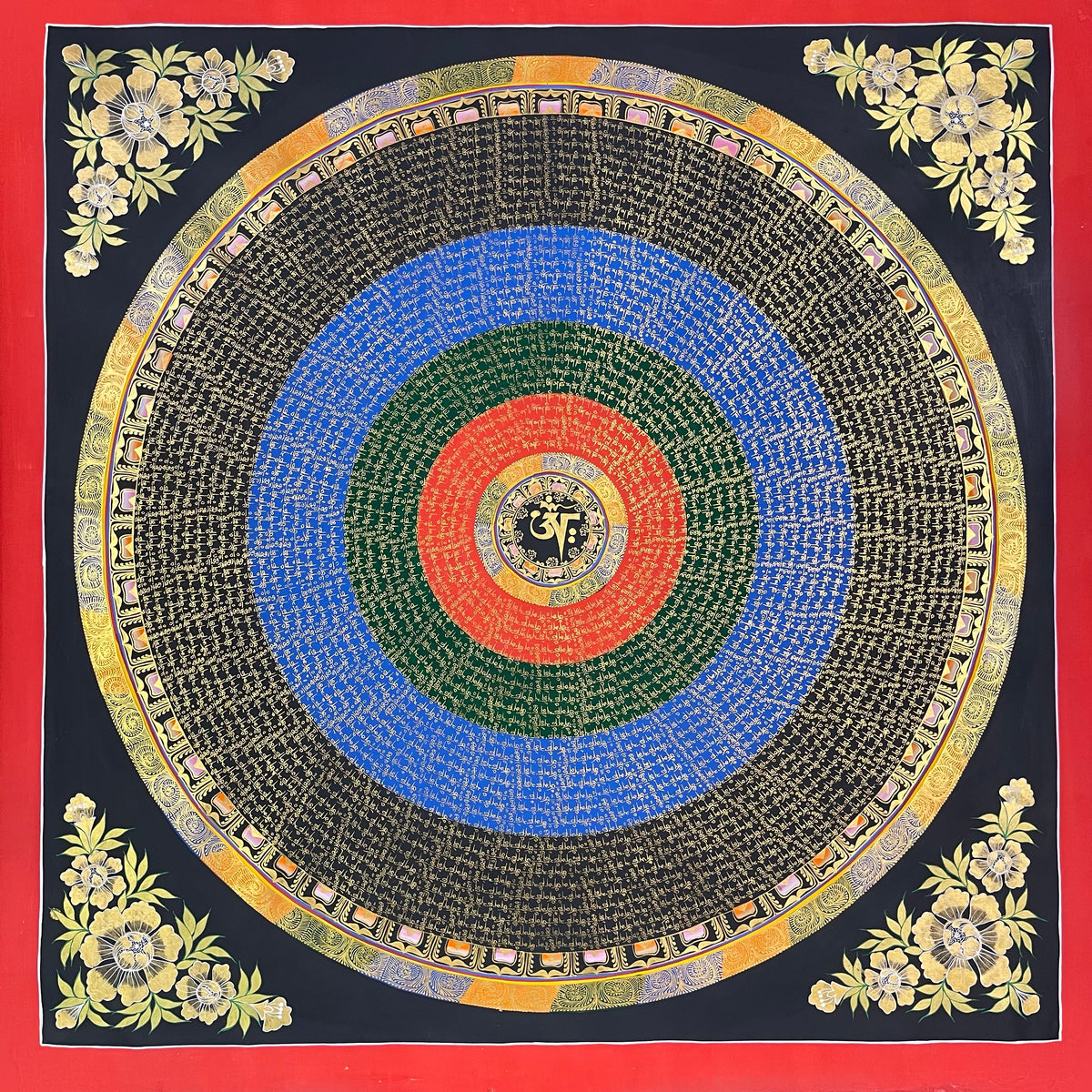 Mantra Mandala thangka, 110×110 cm: bands of gold-coloured mantra script on red, green, blue and black rings around a central Om