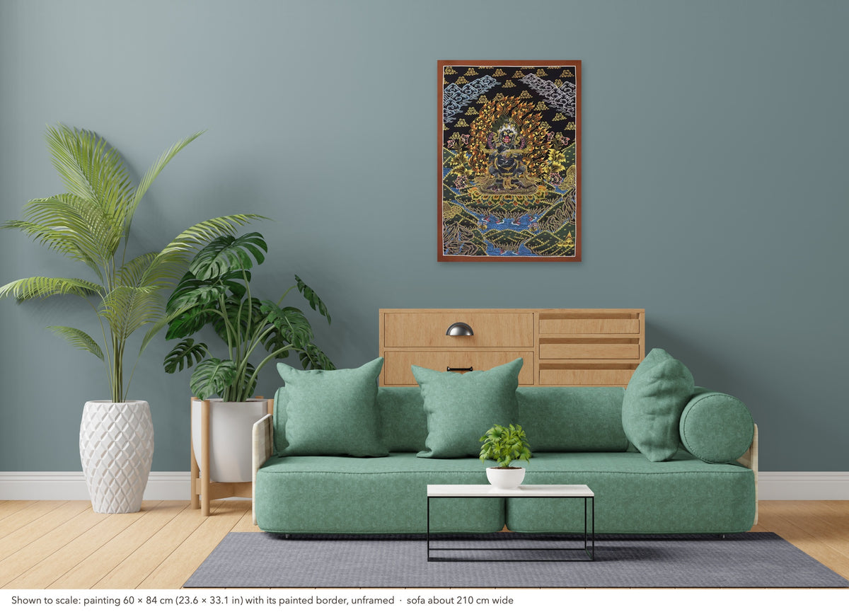 Mahakala thangka shown to scale in a living room, unframed, above a sofa about 210 cm wide (60×84 cm)