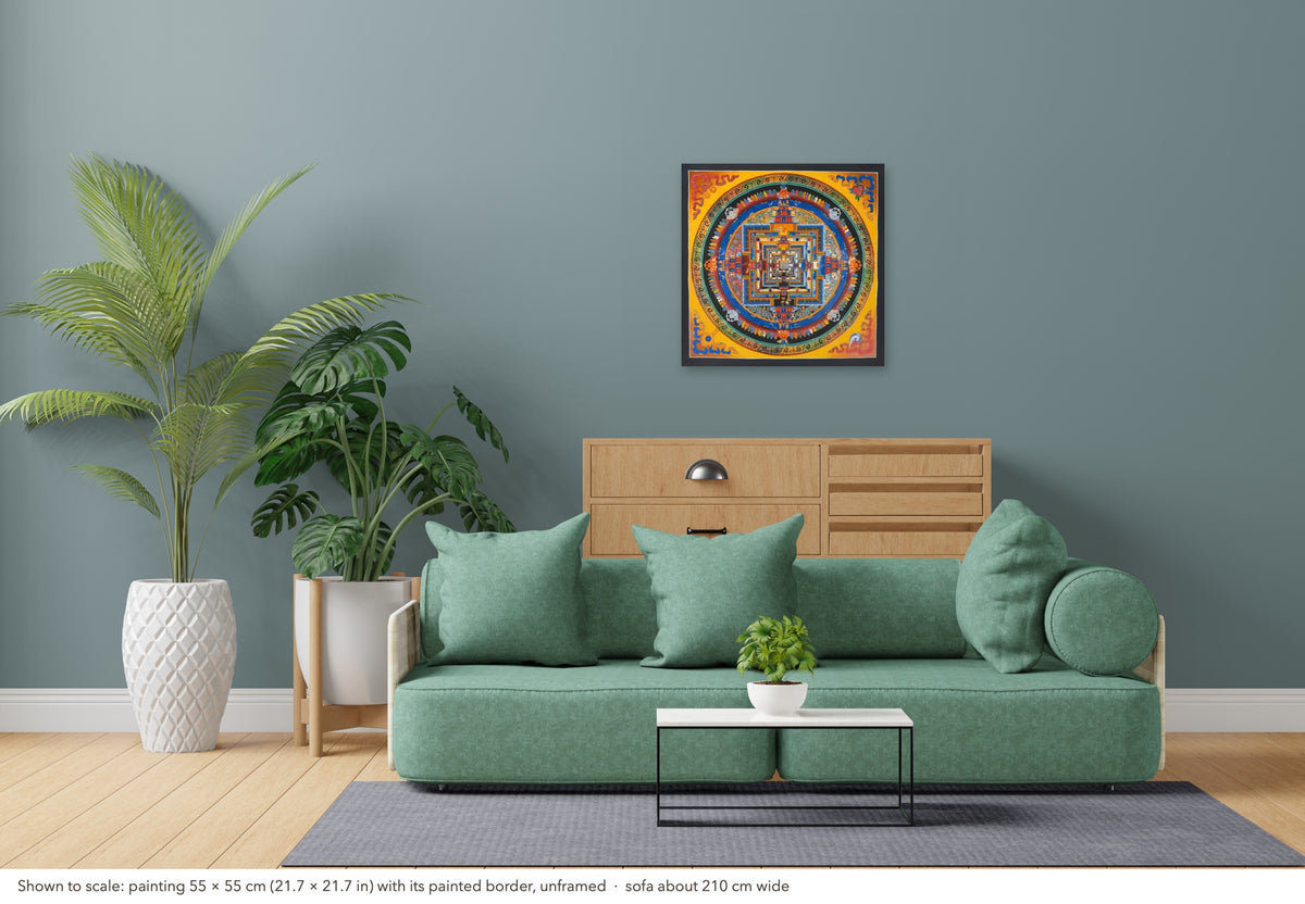 Kalachakra Mandala thangka shown to scale in a living room, unframed, above a sofa about 210 cm wide (55×55 cm)