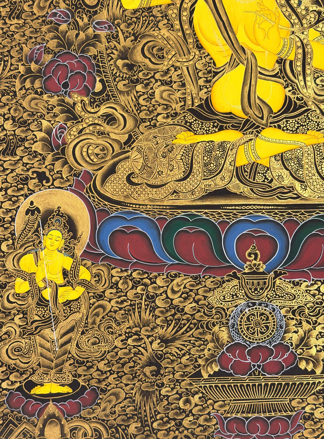 Manjushri thangka, 61×80 cm: Manjushri on a dark ground of dense gold-coloured patterning, with Shakyamuni, Amitayus and the Medicine Buddha above