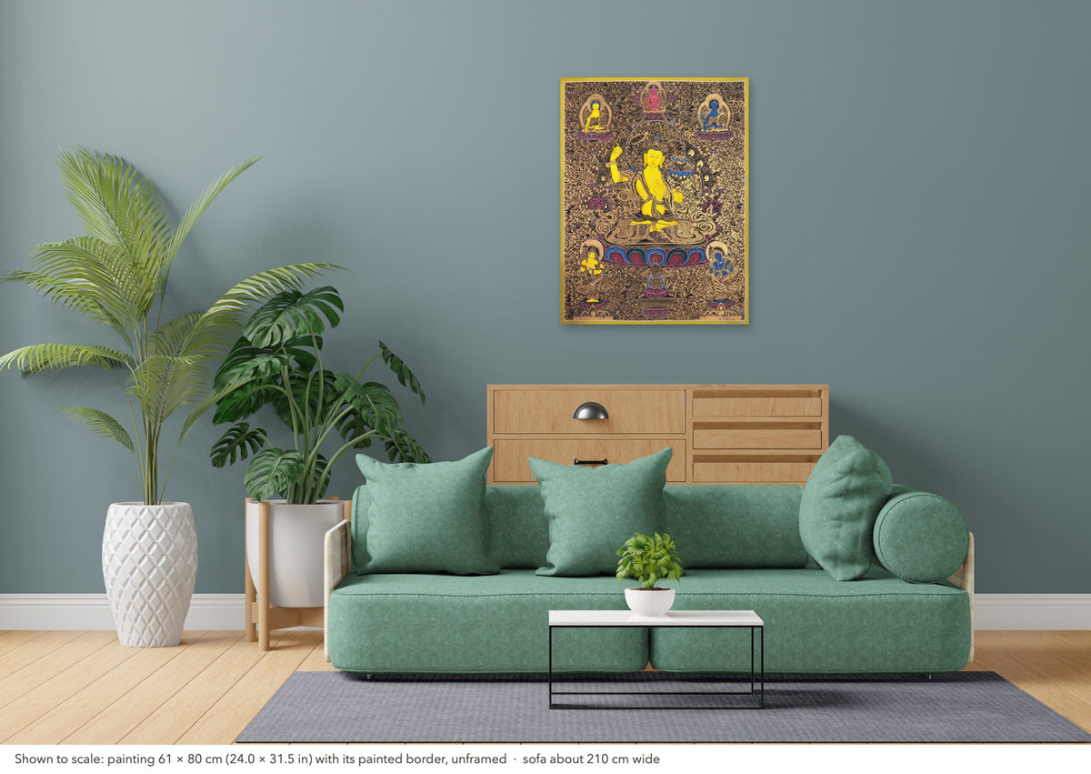 Manjushri thangka shown to scale in a living room, unframed, above a sofa about 210 cm wide (61×80 cm)