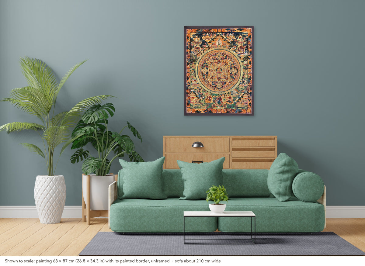 Buddha Mandala thangka shown to scale in a living room, unframed, above a sofa about 210 cm wide (68×87 cm)