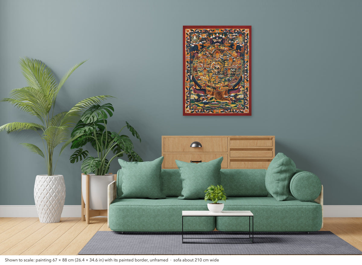 Wheel of Life thangka shown to scale in a living room, unframed, above a sofa about 210 cm wide (67×88 cm)