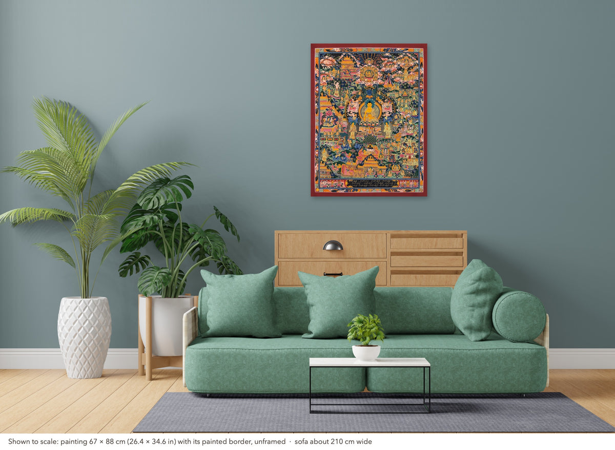 Buddha Life Story thangka shown to scale in a living room, unframed, above a sofa about 210 cm wide (67×88 cm)