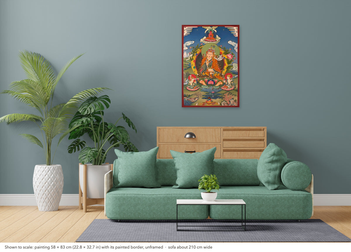 Padmasambhava thangka shown to scale in a living room, unframed, above a sofa about 210 cm wide (58×83 cm)