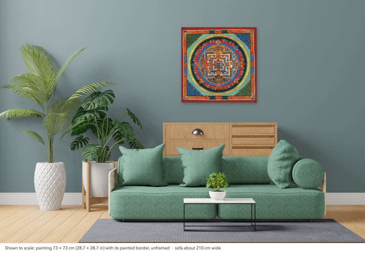 Kalachakra Mandala thangka shown to scale in a living room, unframed, above a sofa about 210 cm wide (73×73 cm)