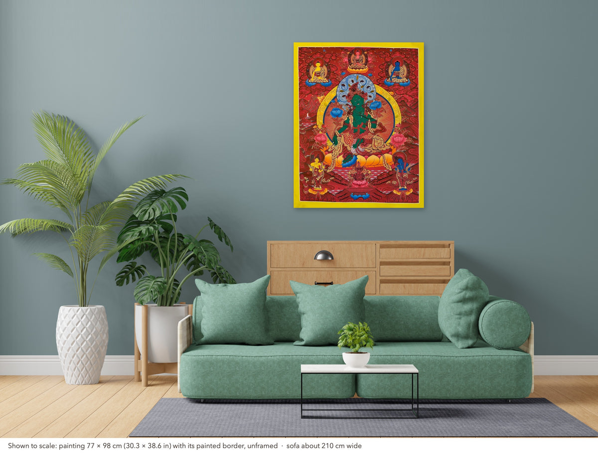 Green Tara thangka shown to scale in a living room, unframed, above a sofa about 210 cm wide (77×98 cm)