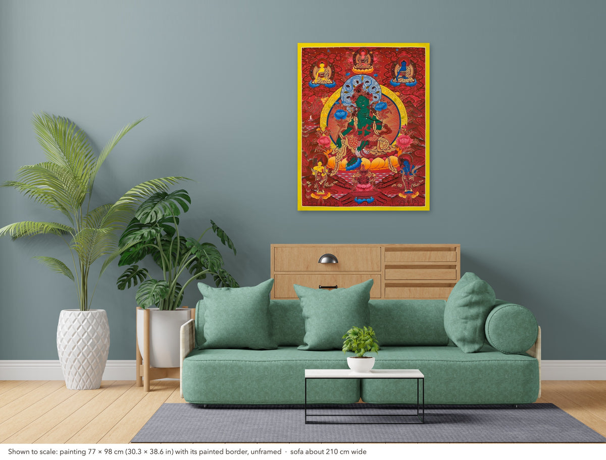 Green Tara thangka shown to scale in a living room, unframed, above a sofa about 210 cm wide (77×98 cm)