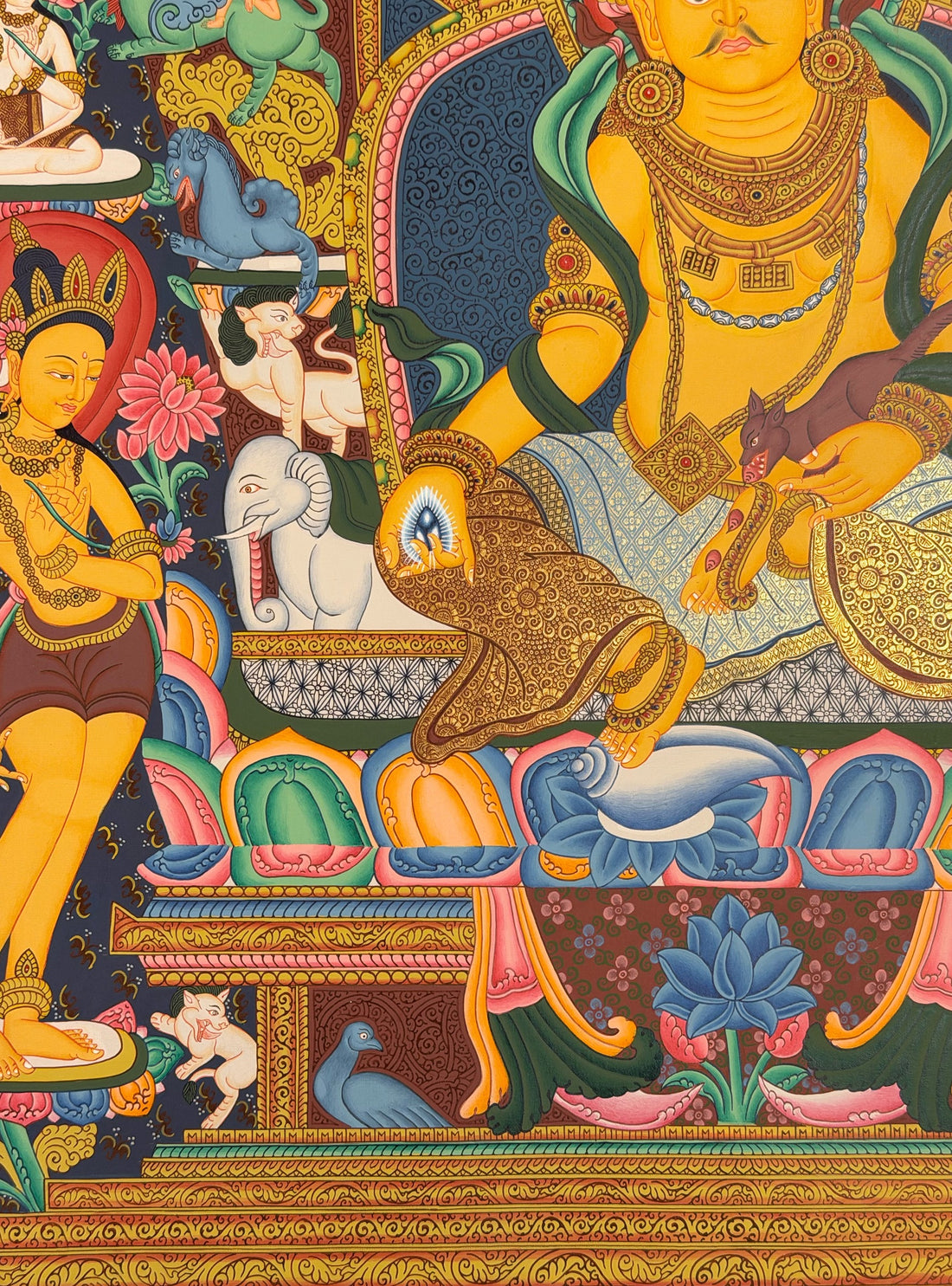 Yellow Jambhala thangka, 66×83 cm: Yellow Jambhala in the Newar style, with six Buddhas above and rows of crowned figures at the sides