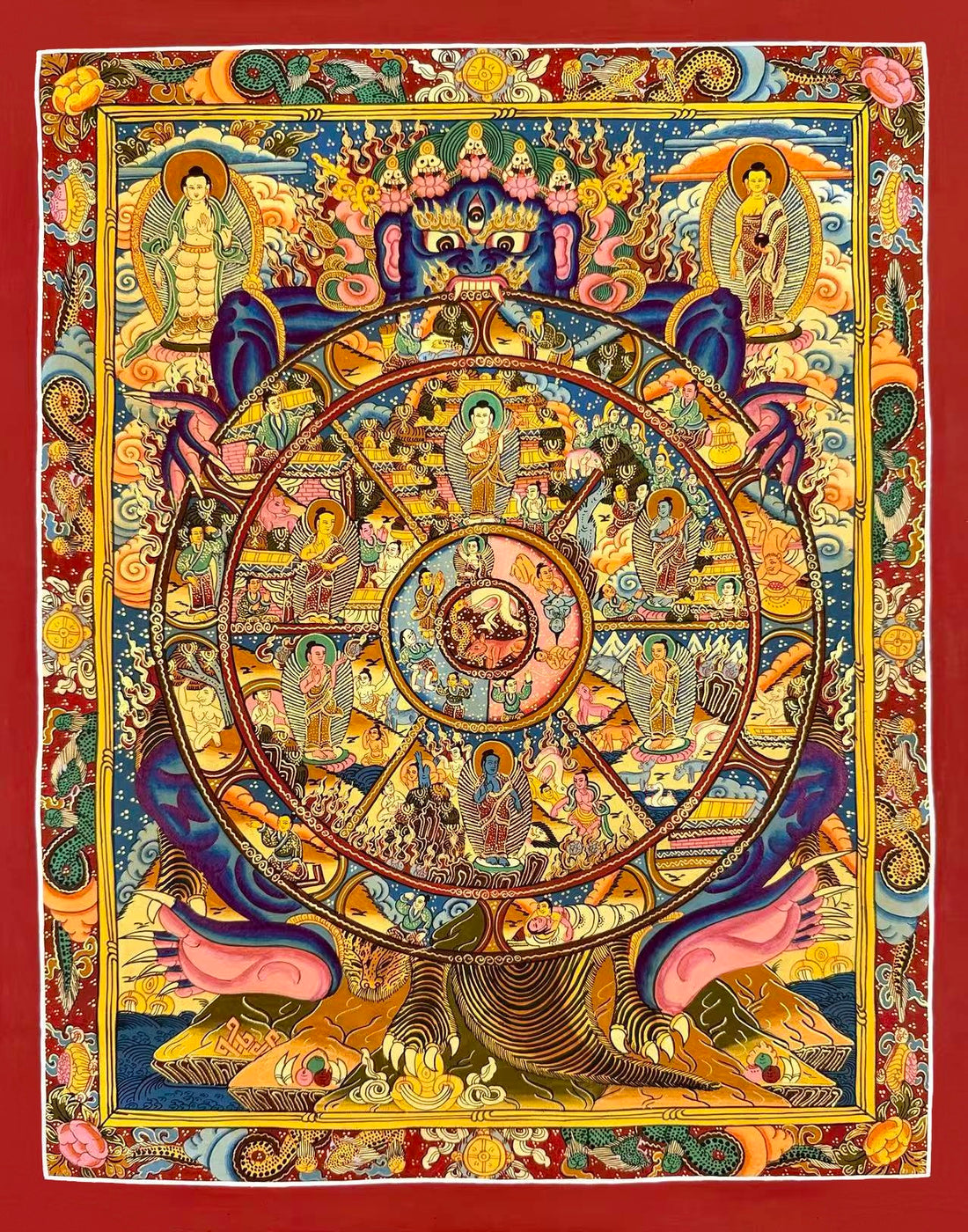Wheel of Life thangka, 45×56 cm: blue Yama holding the Wheel of Life with a Buddha in each realm, inside a red border of dragons