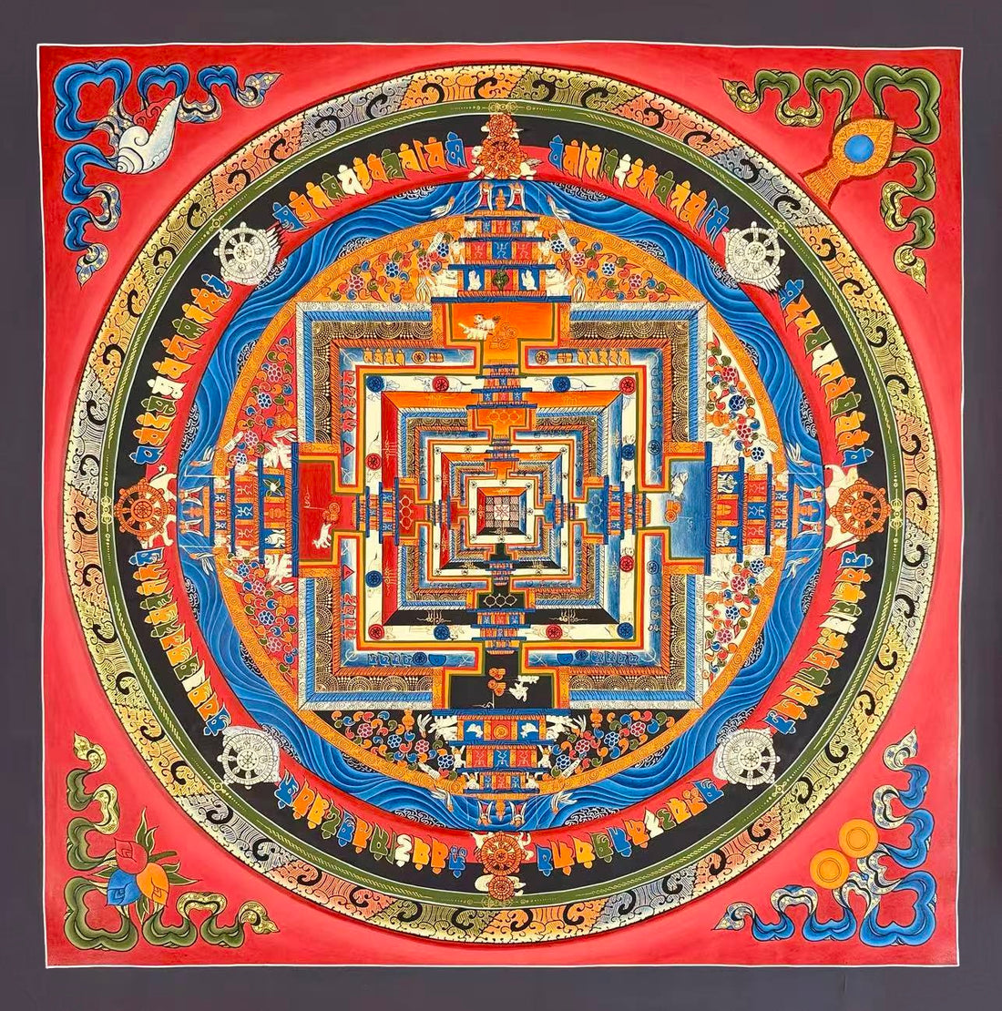 Kalachakra Mandala thangka, 77×77 cm: Kalachakra palace mandala with rings of mantra syllables and dharma wheels on a vermilion ground