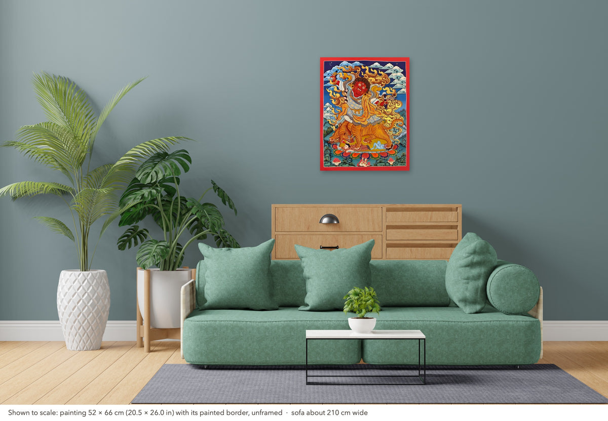 Dorje Drolo thangka shown to scale in a living room, unframed, above a sofa about 210 cm wide (52×66 cm)
