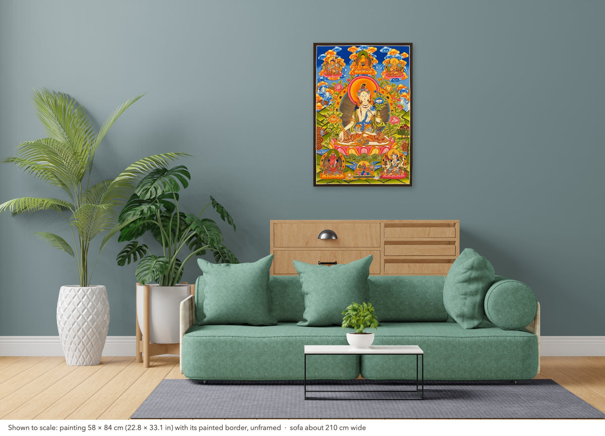 White Tara thangka shown to scale in a living room, unframed, above a sofa about 210 cm wide (58×84 cm)