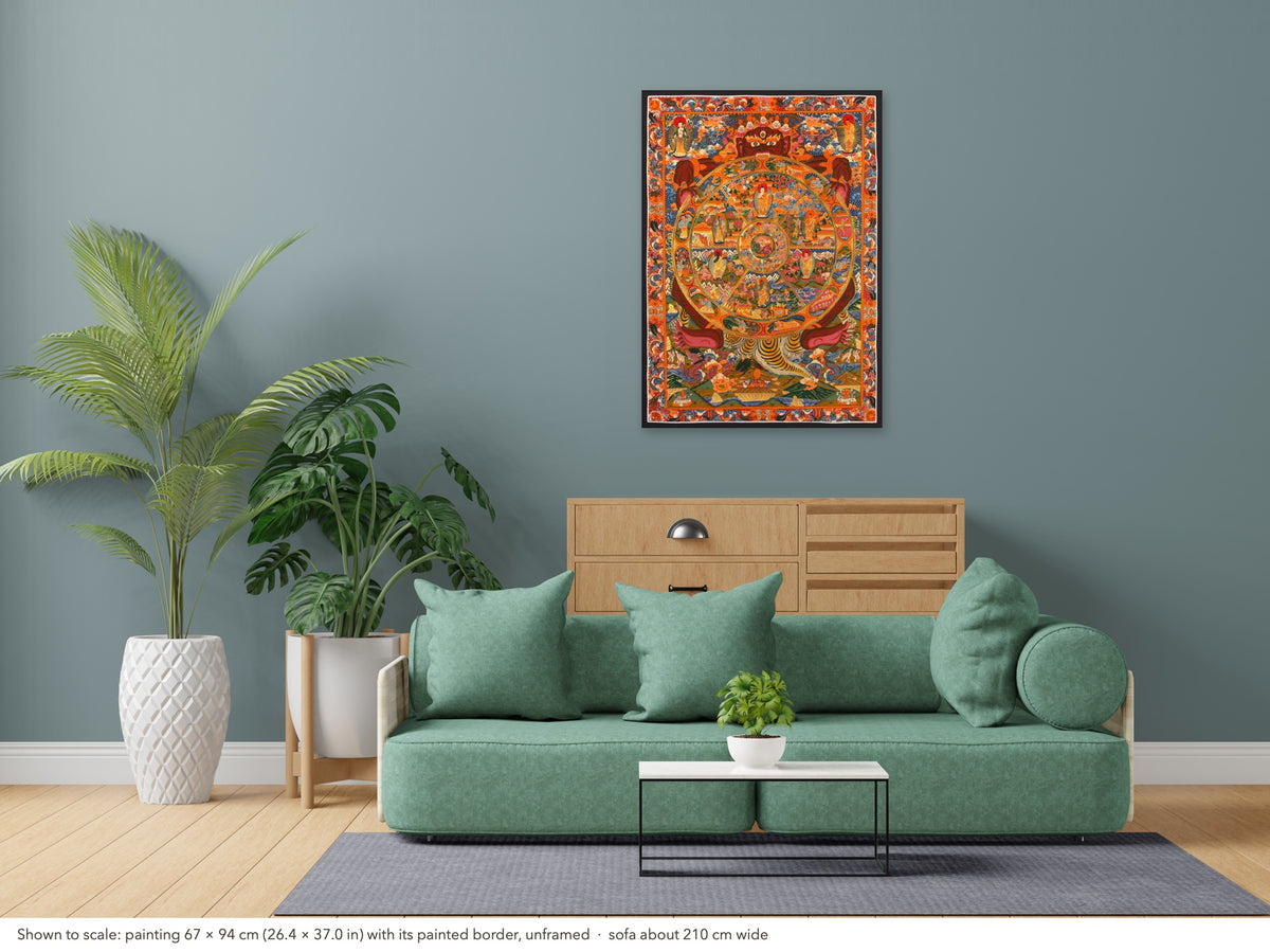 Wheel of Life thangka shown to scale in a living room, unframed, above a sofa about 210 cm wide (67×94 cm)
