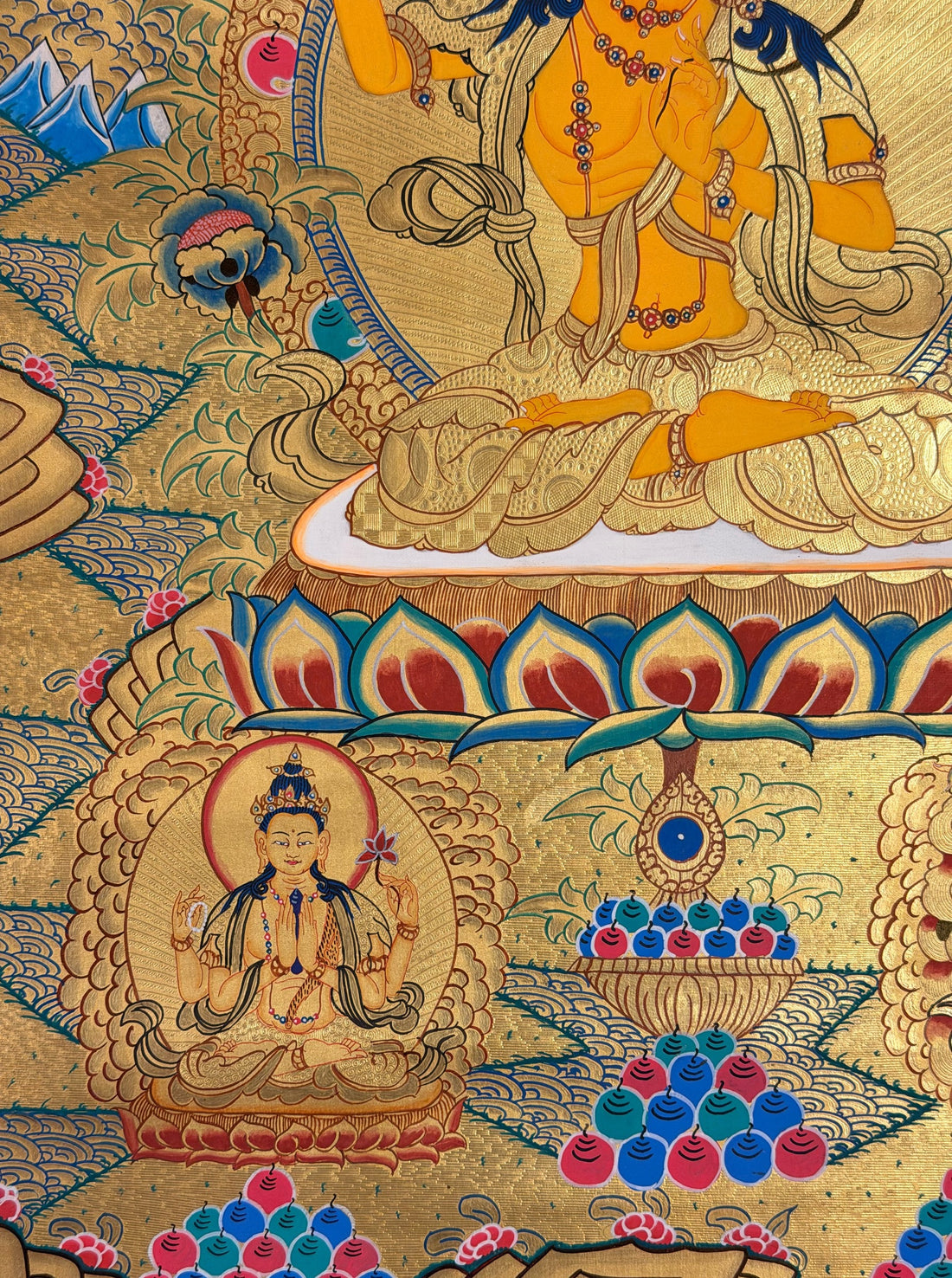 Manjushri thangka, 58×83 cm: Manjushri raising his flaming sword on a gold-coloured ground, with five Buddhas above and Chenrezig and Vajrapani below