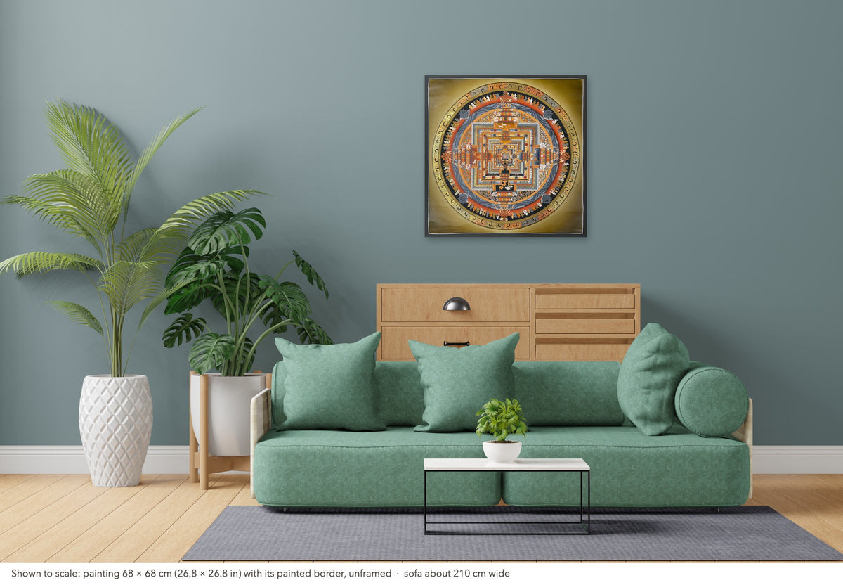 Kalachakra Mandala thangka shown to scale in a living room, unframed, above a sofa about 210 cm wide (68×68 cm)
